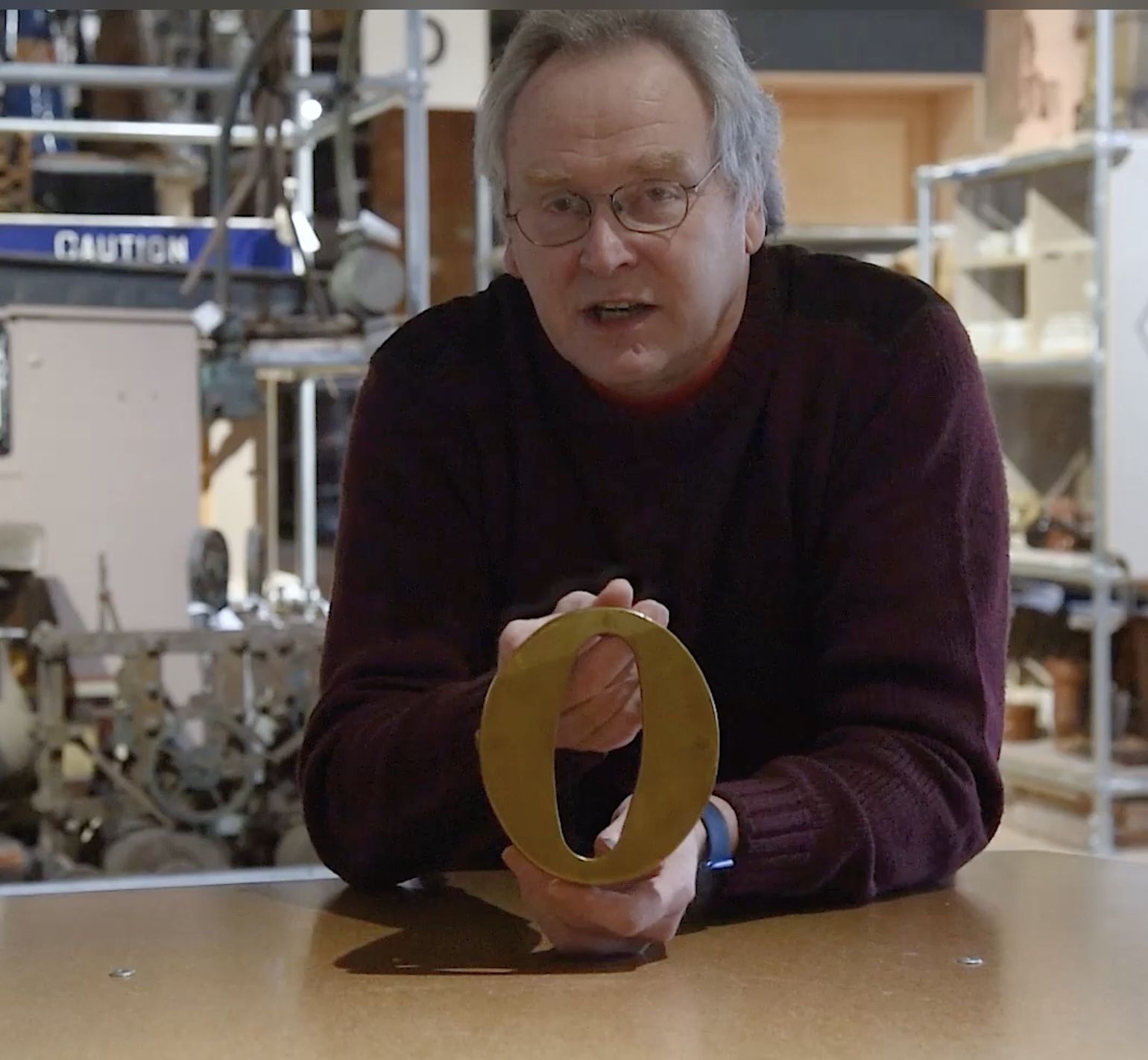 The Study Centre co-ordinator, Dave Harris, holds a brass figure 0 which he talks about in the linked video