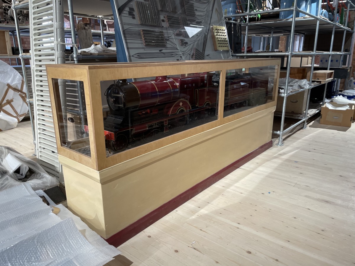 A large and detailed model of a Midland Raillway 'compund' locomotive in a display case