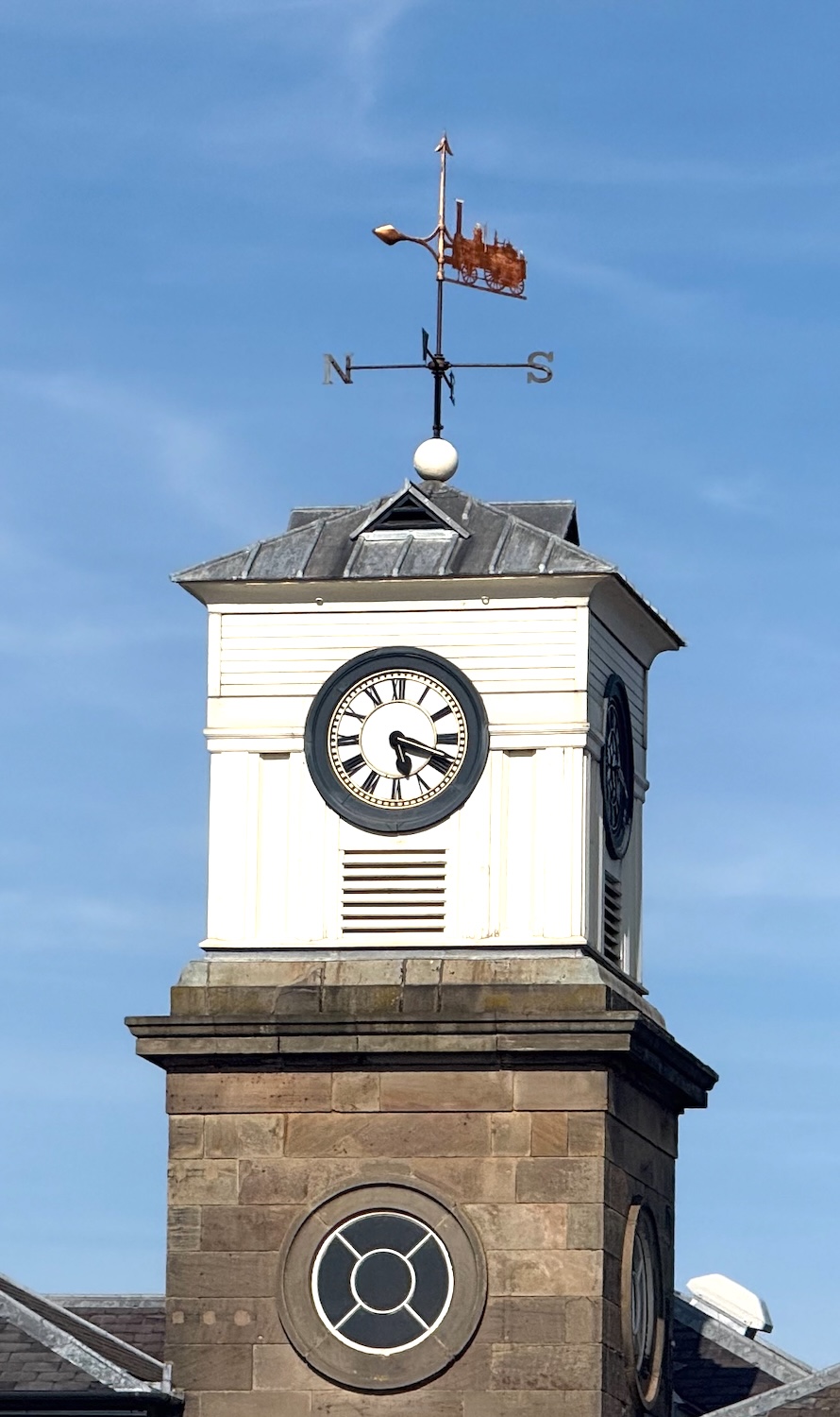 The clock tower of the Derby Roundhouse (also known as Engine Shed No.1) with its distinctive golden weather vane formed of a very early type of steam locomotive