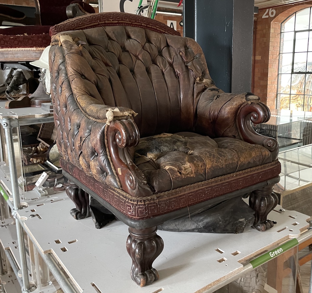A very time-work leather arm chair