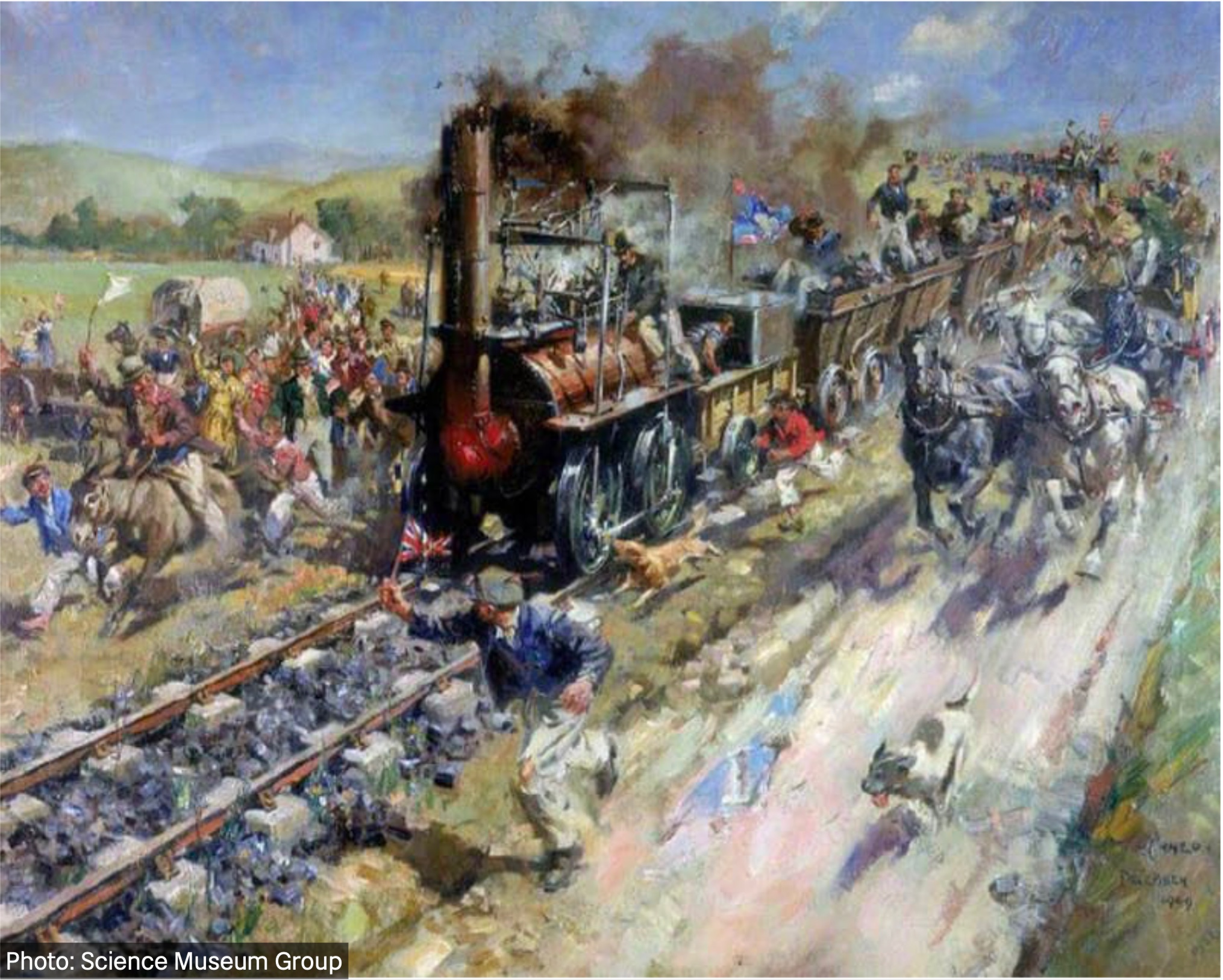 An oil painting depicting Locomotion No.1, a steam engine hauling a rake of wagons filled with people past an excited crowd on both sides of the line of railway with others on horseback attempting to keep up, as a man runs in front holding a small union jack flag and a dog tries to scare off the smoke-belching engine.