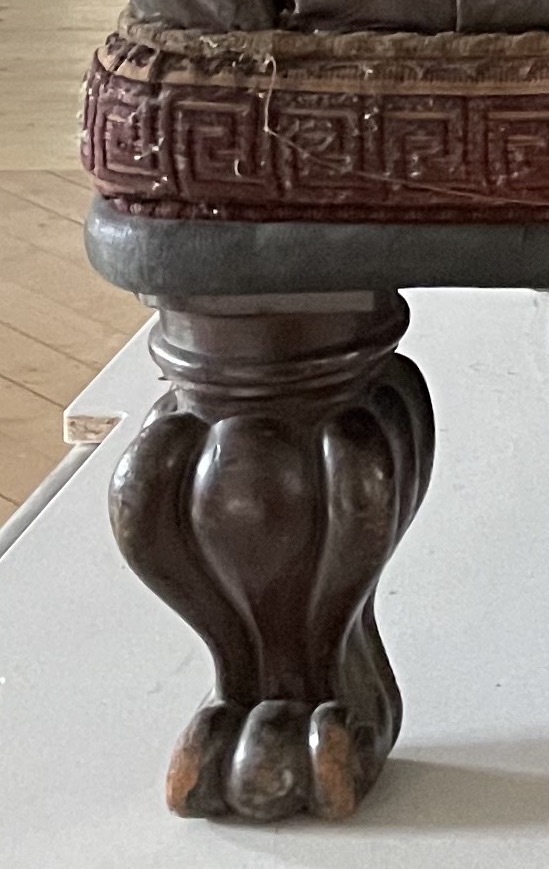 An ornately carved wooden leg