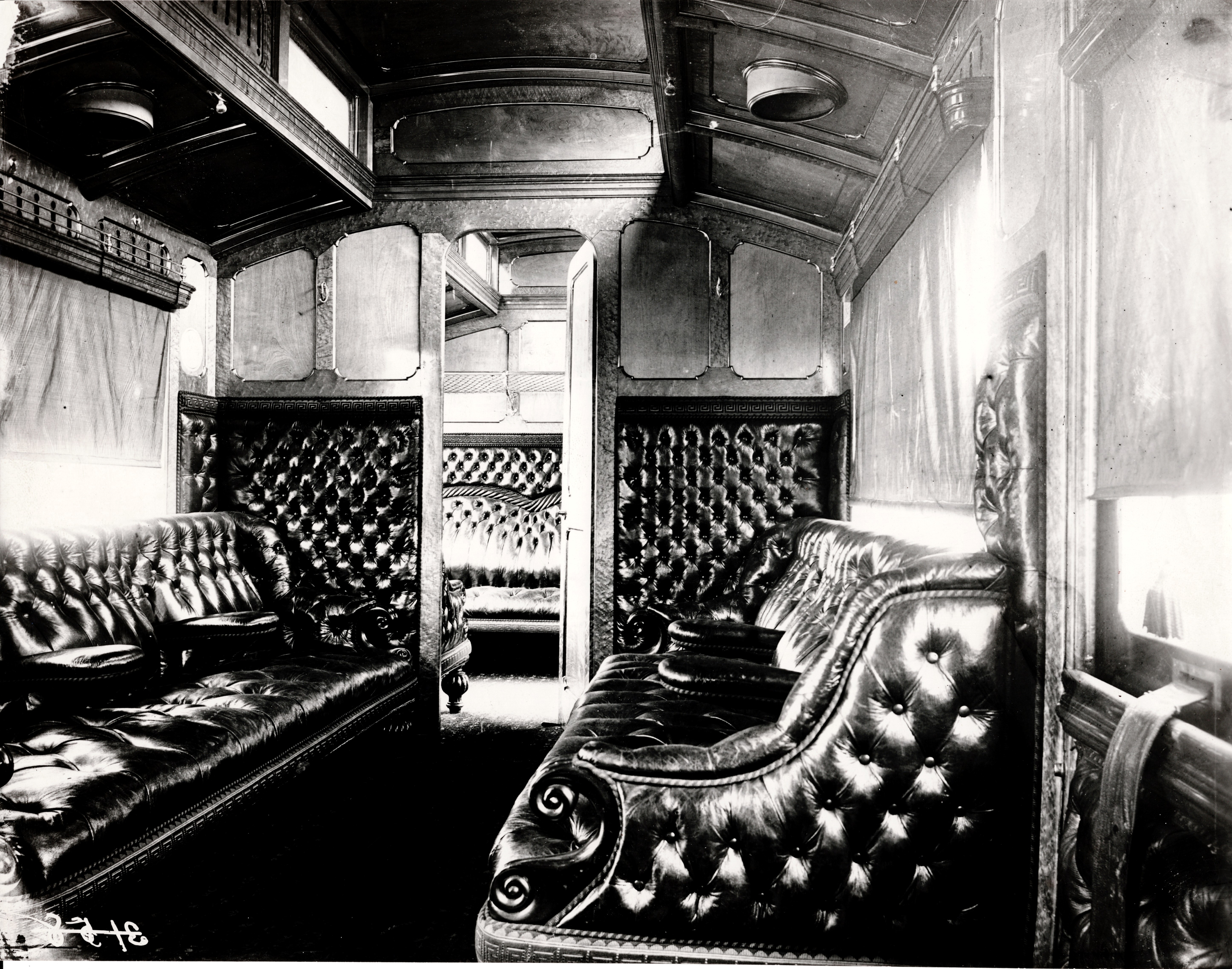 A view inside a Family Saloon cariage with plush leather settees and seats