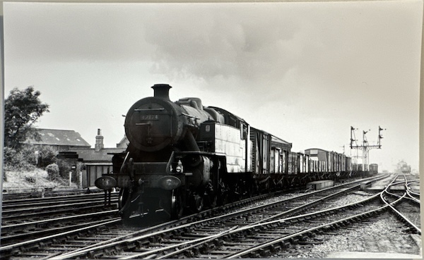 Fairburn 2-6-4T No.42174 at the head of a mixed goods enters an unidentifed station.