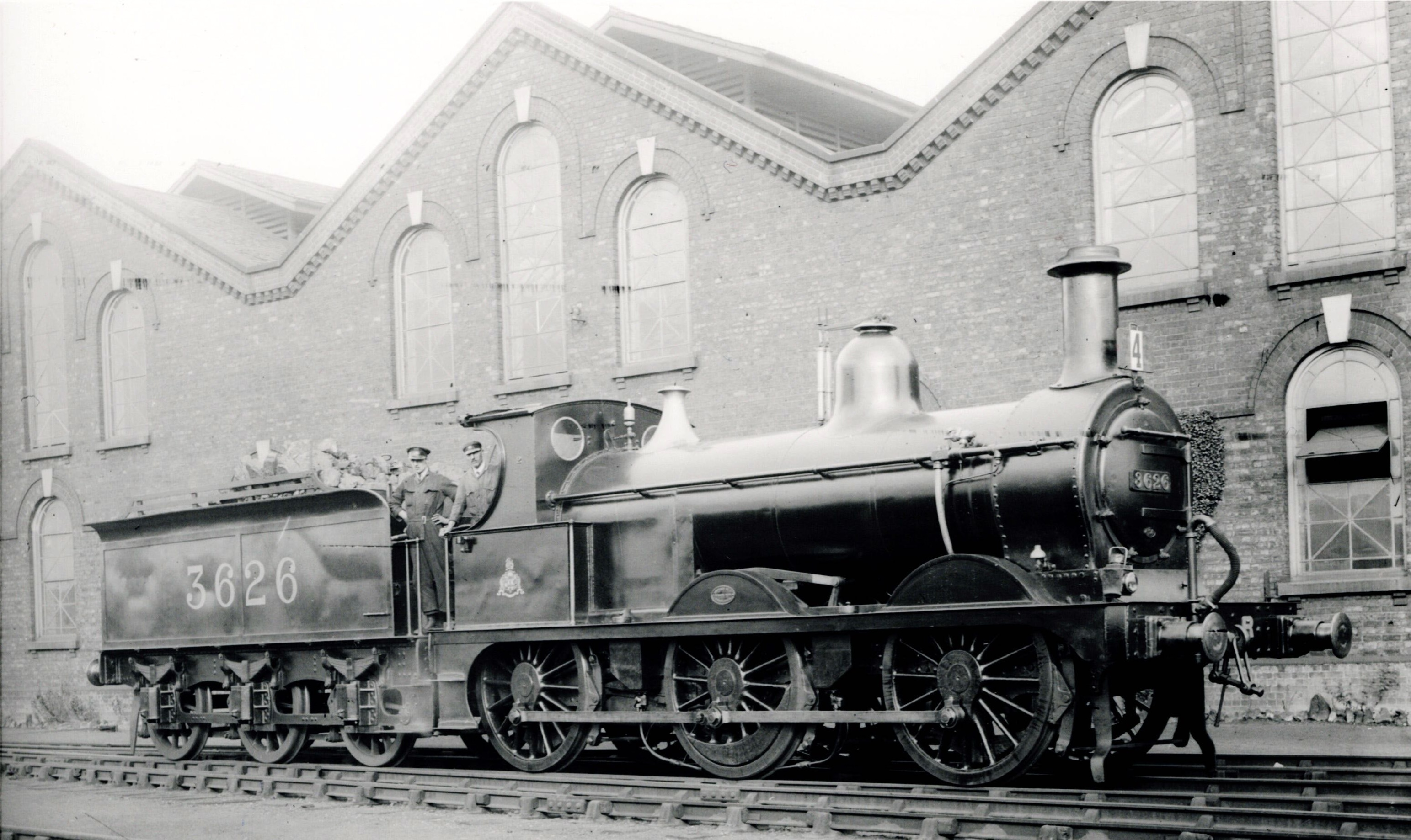 Midland Railway 1873 Class steam locomotive No. 3626 in front of a brick building with arched windows at Wellingborough engine shed in 1922.