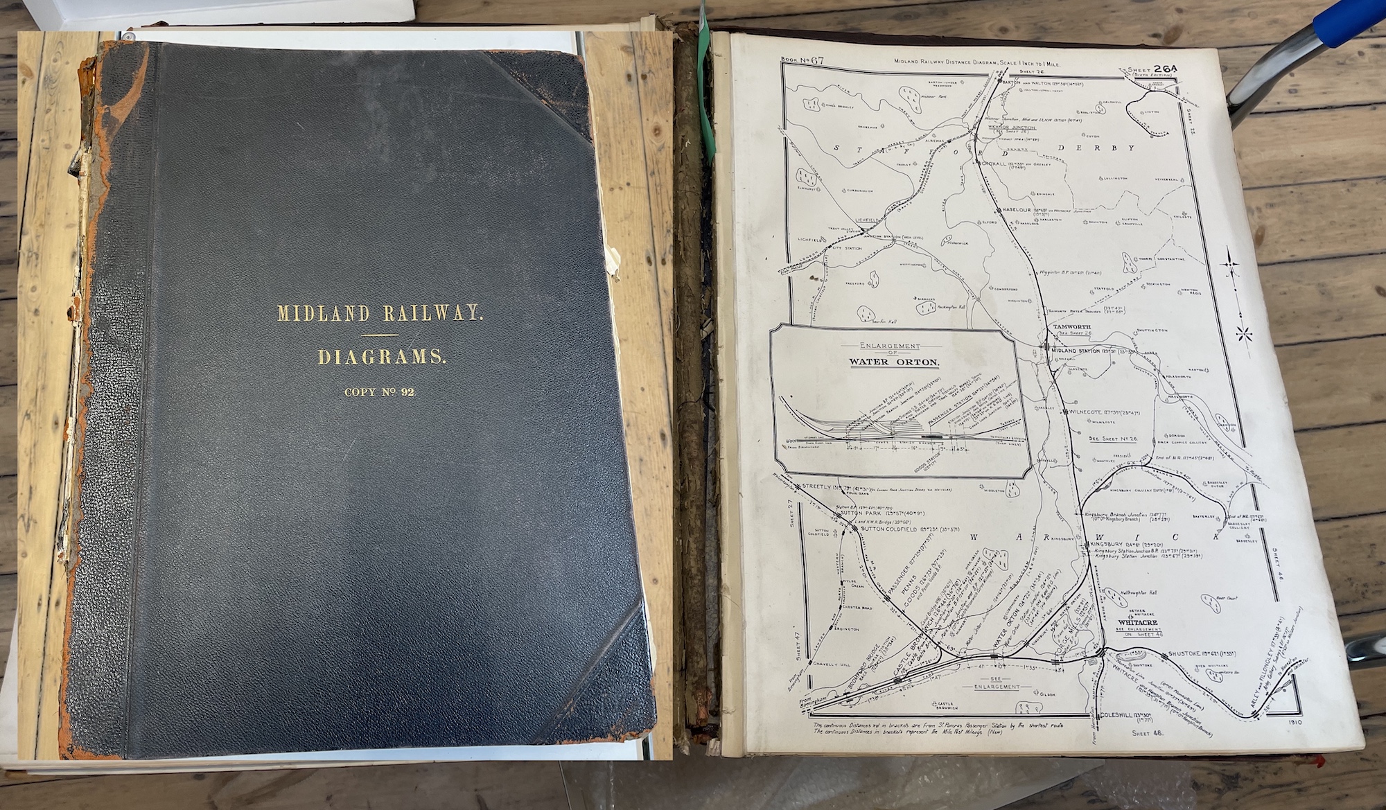 A large ledger with a map sheet showing part of the Midland Railway network on the right, with inset on the left, a gilt inscribed cover reading MIDLAND RAILWAY. DIAGRAMS. COPY NO 92