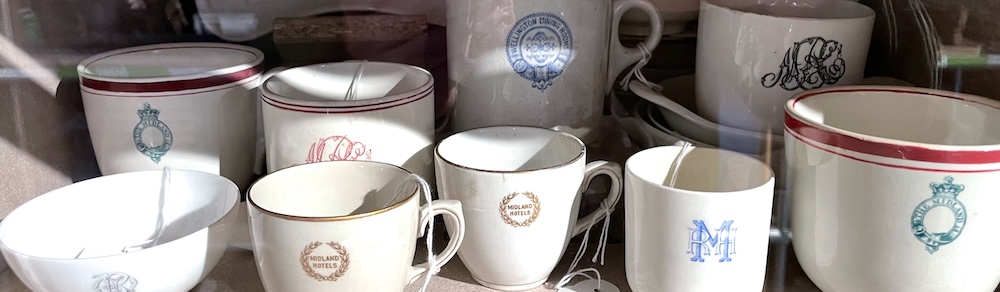 Nine mugs and cups with assorted other Midland Railway crockery