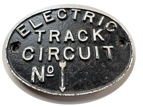 A cast iron sign reading Electric Track Circuit No. then blank with a dowen arrow. Our ref: RFB32782
