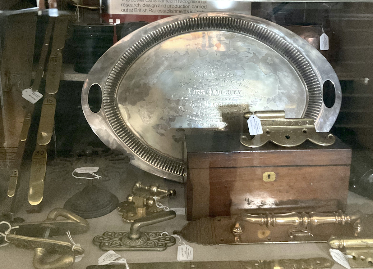 A large silver plate tray on display in the Assemblage